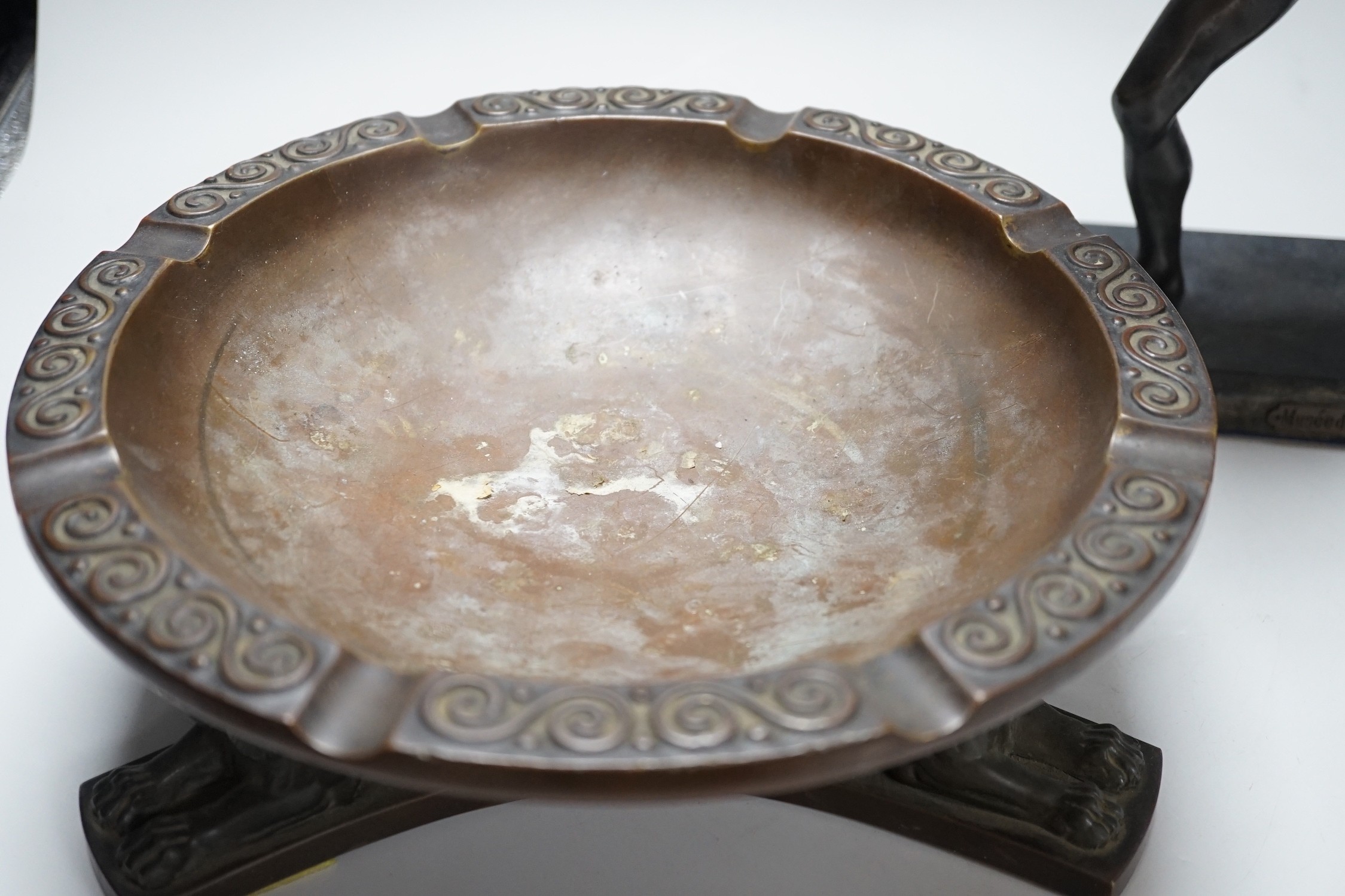 A large bronze dish, on triform lion base, and a bronze-finished warrior, dish 28cms diameter